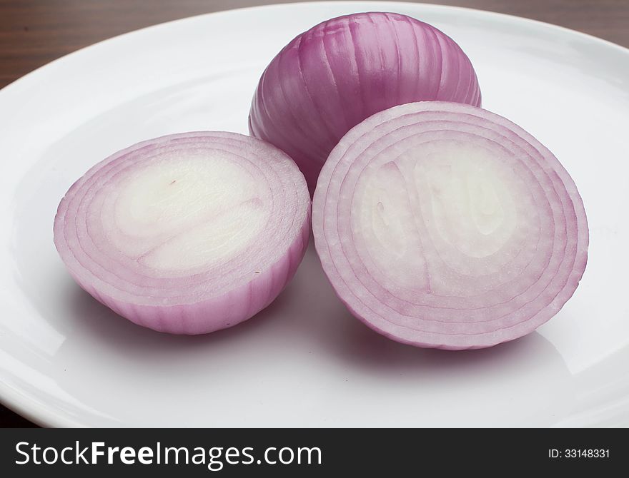 Large shallots on a plate. Large shallots on a plate