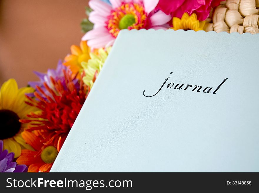 Blue journal with colorful flowers