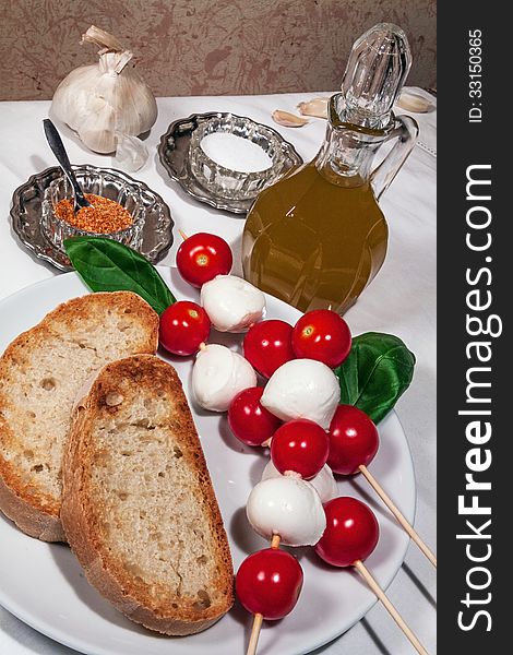 Bread, garlic, basil and olive oil for simple italian bruschetta
