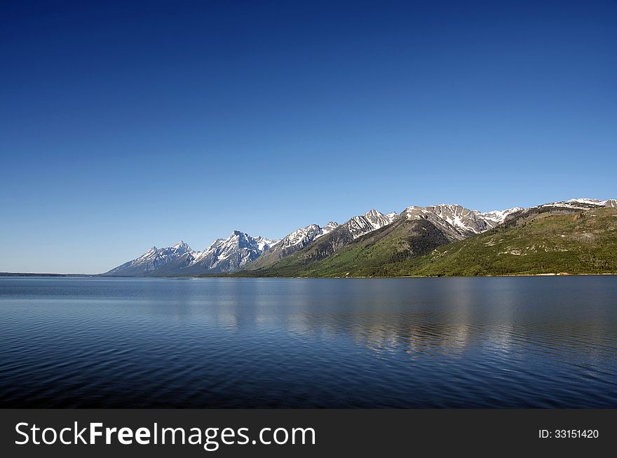A view of the Grand Teton mountain range from the northern end of Jackson lake. A view of the Grand Teton mountain range from the northern end of Jackson lake.