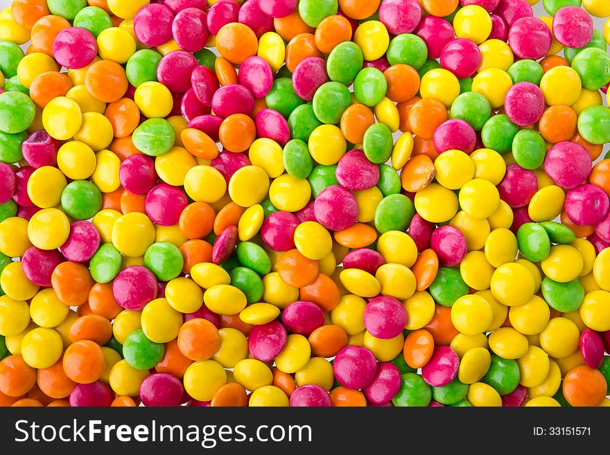 Mixed colorful candies on white background