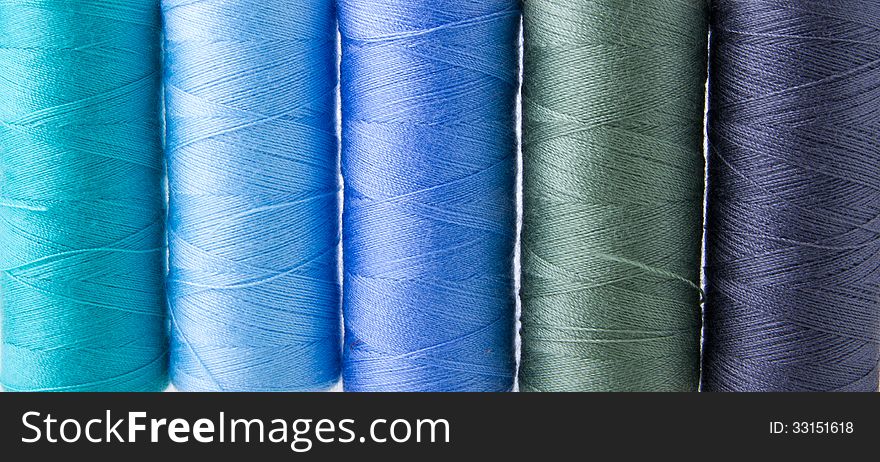 Sewing threads multicolored on white background