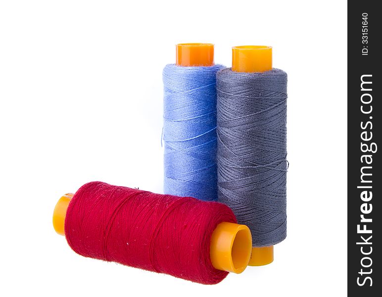 Sewing threads multicolored isolated on white background