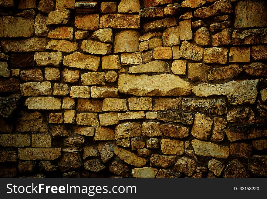Wall made ​​of natural stone. Wall made ​​of natural stone
