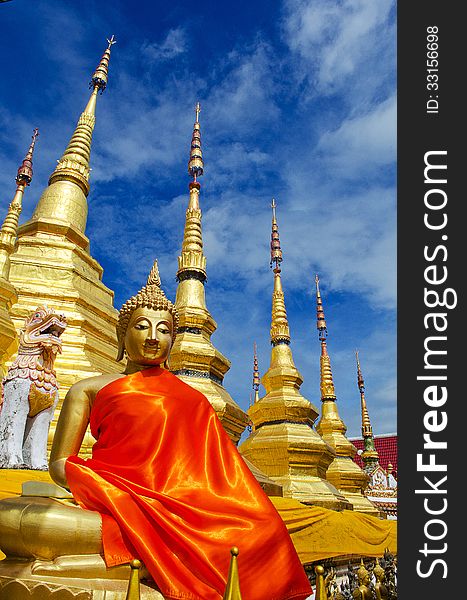 The Gloden Seated Buddha Image with Golden Pagoda