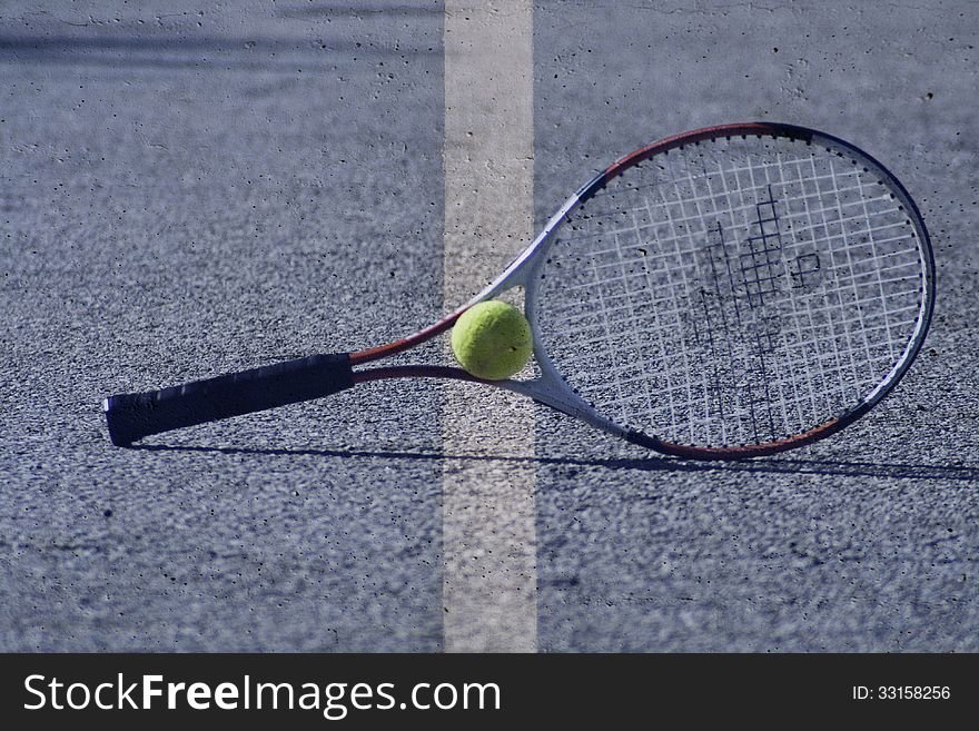 Tennis racket and ball on abstract background with white line