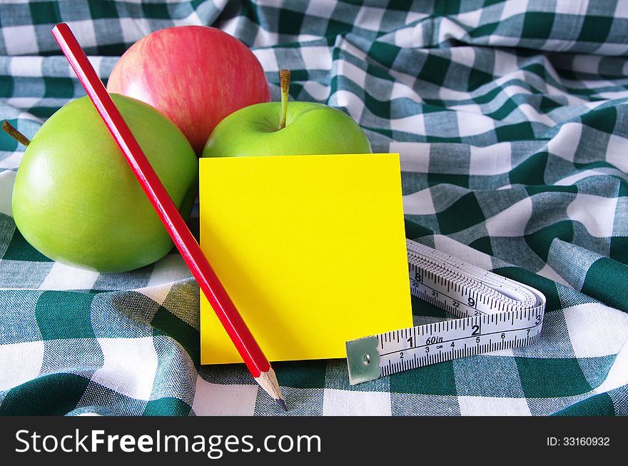 Apples measuring tape and note pad. Apples measuring tape and note pad