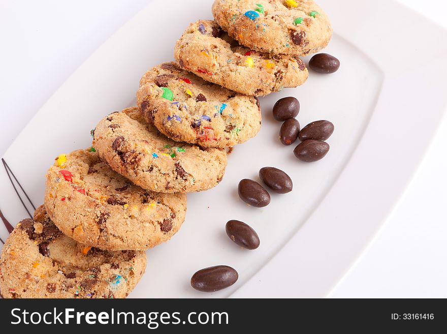 Cookies and chocolate balls on White dish. Cookies and chocolate balls on White dish