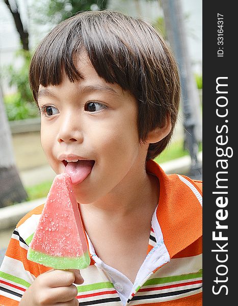 Little boy eating ice cream watermelon