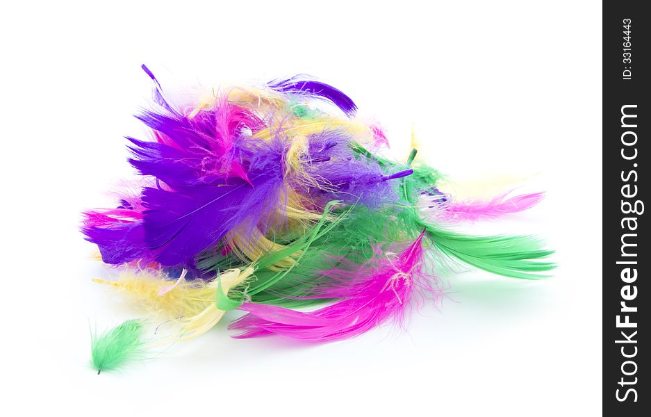 Pile of colorful feathers isolated on white background