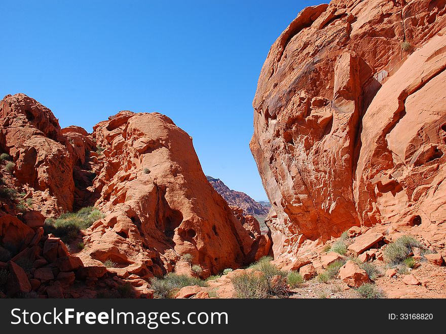 Redstone is on the North Shore Drive in Lake Mead NRA. It is about 40 miles outside of Las Vegas, about 20 miles past the Callville Bay cutoff and about 10 away from the Echo Bay junction. Hiking is available through this heavily eroded fossilized sand dunes which dates back to the Jurassic Period about 120 million years ago. Redstone is on the North Shore Drive in Lake Mead NRA. It is about 40 miles outside of Las Vegas, about 20 miles past the Callville Bay cutoff and about 10 away from the Echo Bay junction. Hiking is available through this heavily eroded fossilized sand dunes which dates back to the Jurassic Period about 120 million years ago.