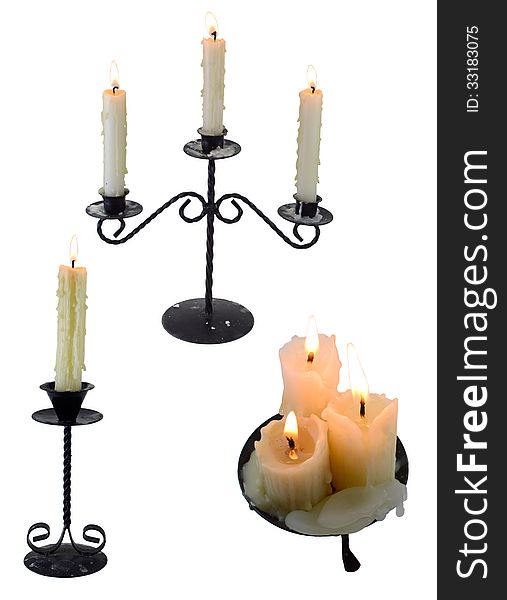 Three retro candlesticks with burning candles isolated. Three retro candlesticks with burning candles isolated