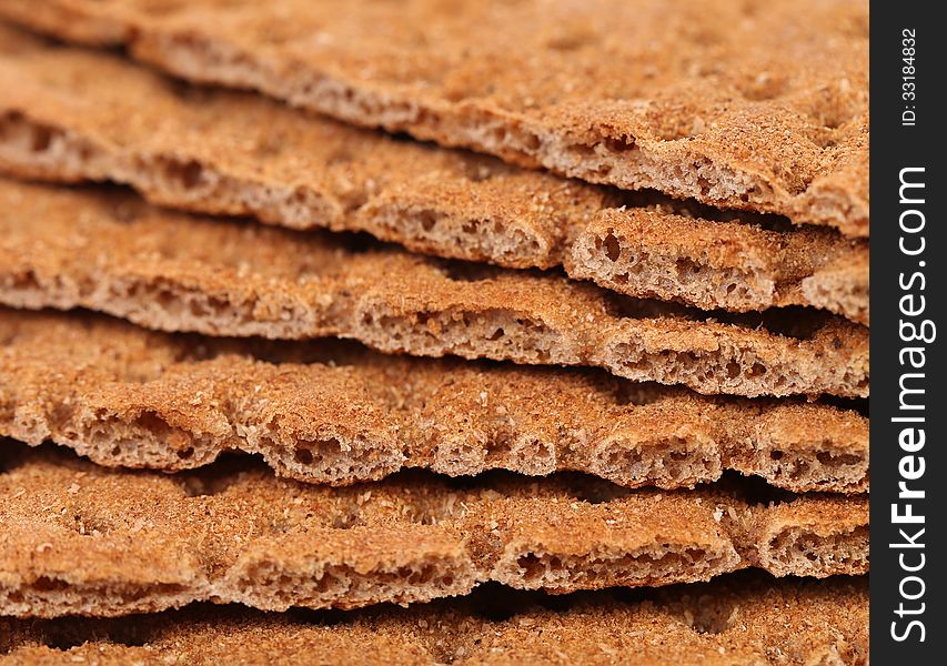 Background of bread crisps. Macro. Whole background.