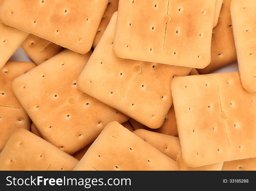 Background of stake saltine soda cracker. Macro.