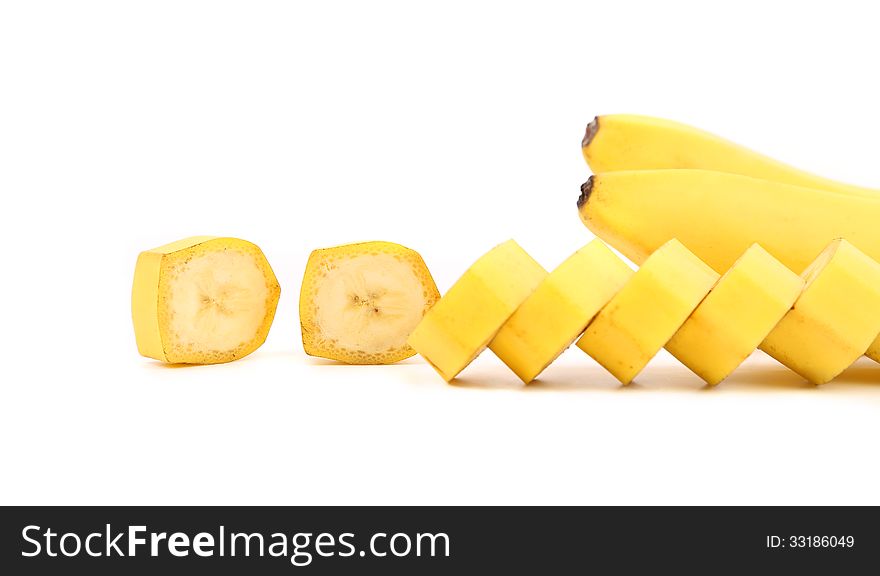 Bananas and slices on a white background