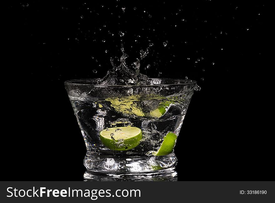 Lemon splashing in water on a black background