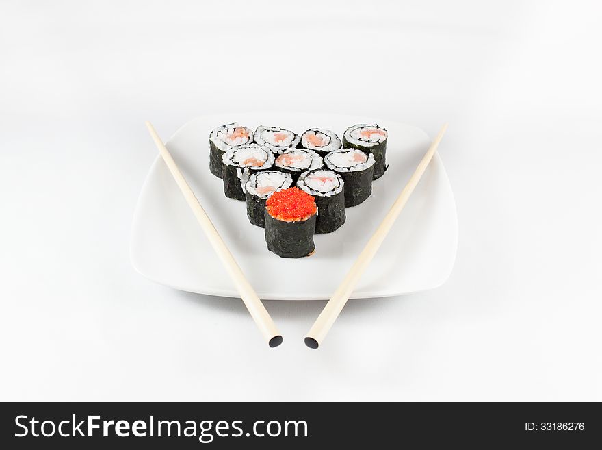 Sushi menu and chopsticks on plate, white background, traditional food in Japan, Asia