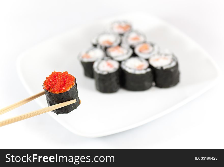 Sushi menu and chopsticks and red caviar, traditional food in Japan and Asia. Sushi menu and chopsticks and red caviar, traditional food in Japan and Asia