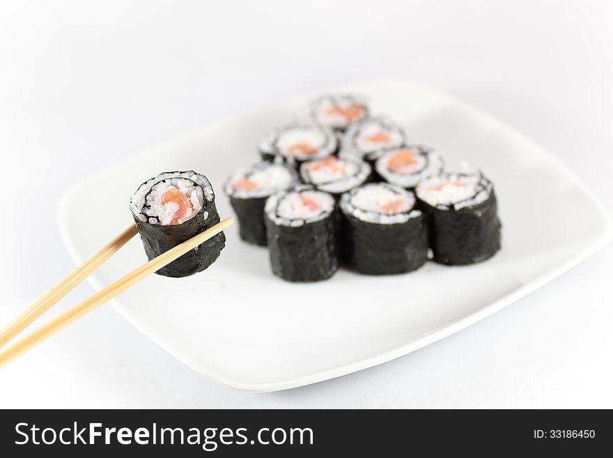 Sushi menu and chopsticks, traditional food in eastern Asia, Japan, on white background