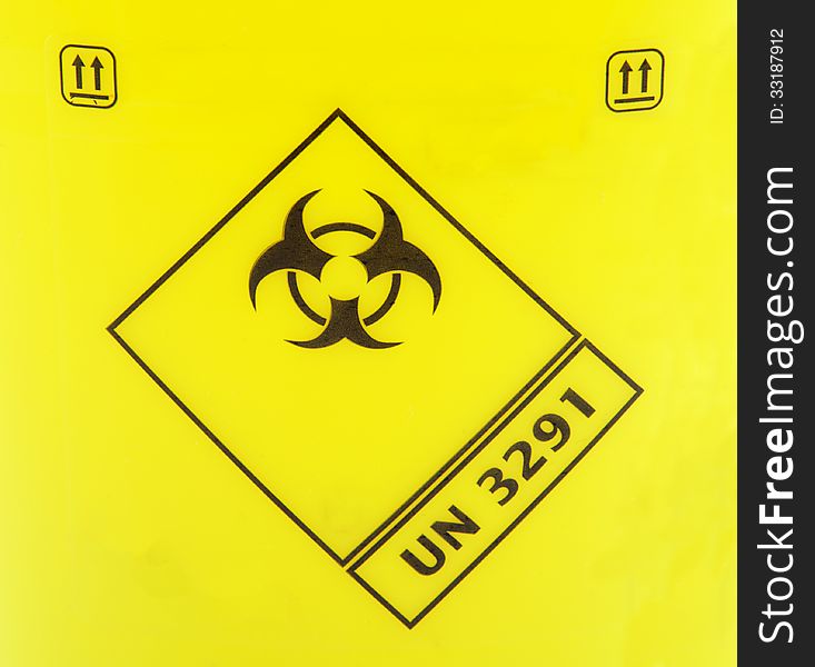 Biohazard sign on a yellow background.
