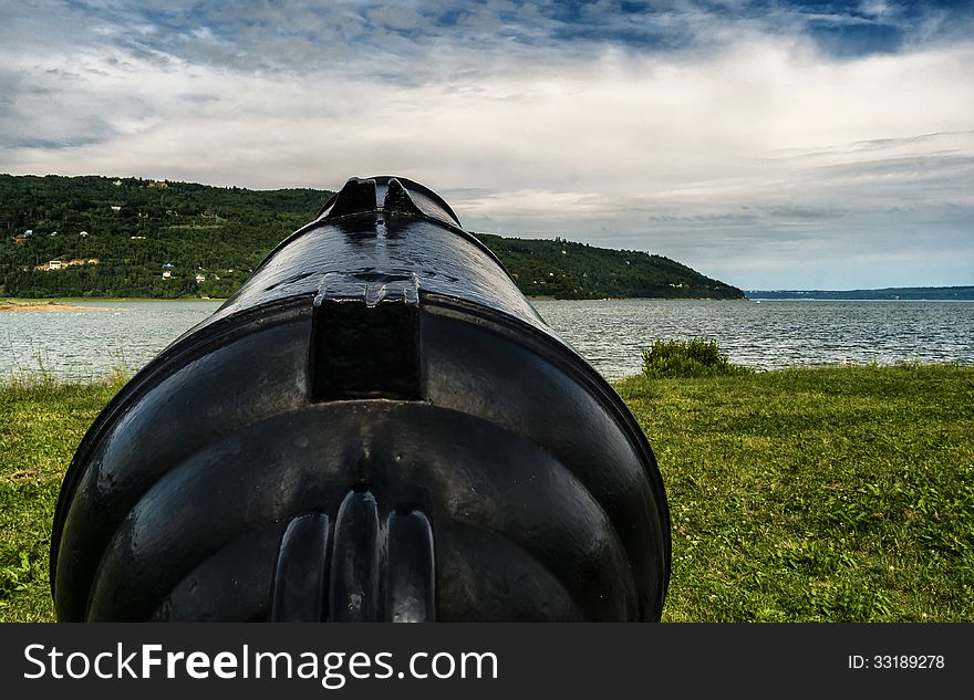 Old canon beside the Saint-Lawrence in Baie Saint-Paul near Quebec city