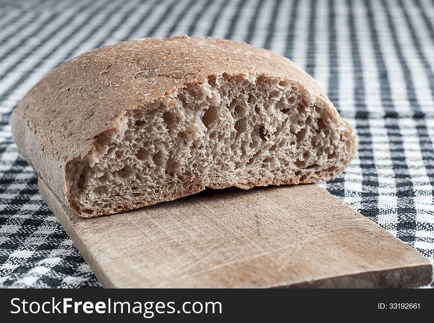 Homemade bread on the cutting board, close up