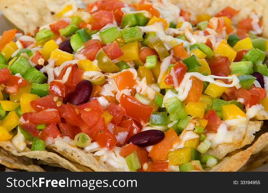 Mexican baked nachos close up. Mexican baked nachos close up