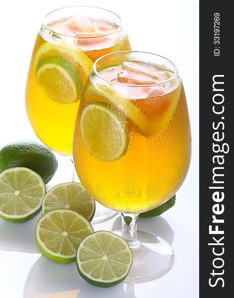 Lime with citrus cocktail glasses on a white background. Lime with citrus cocktail glasses on a white background