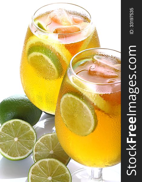 Lime with citrus cocktail glasses on a white background. Lime with citrus cocktail glasses on a white background