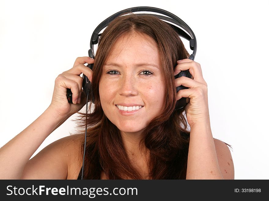 Girl with headphones smiling over white background. Girl with headphones smiling over white background