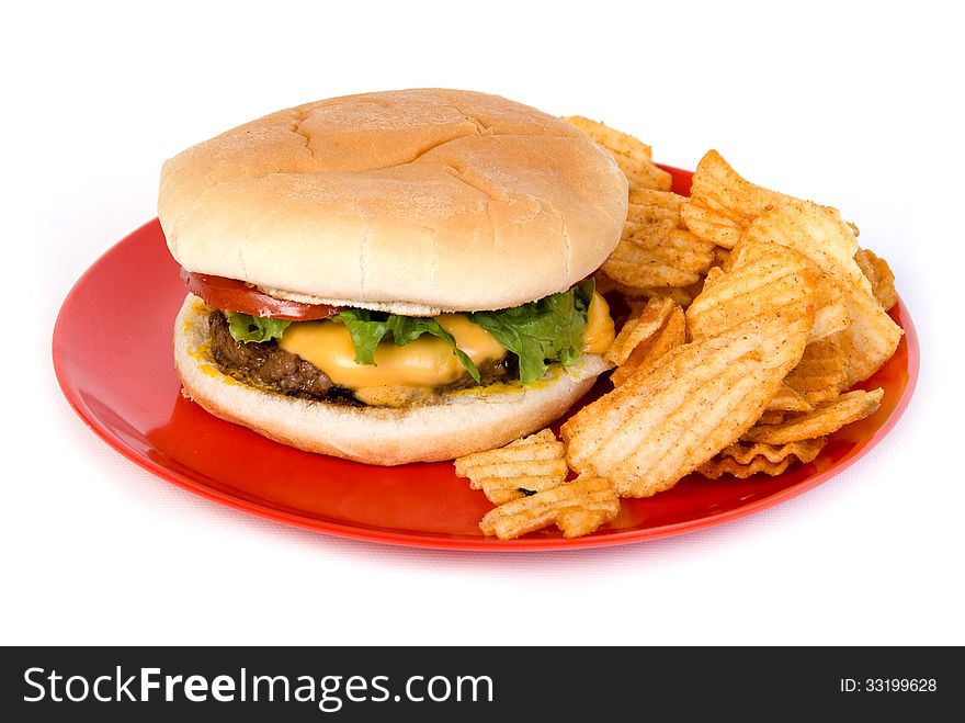 cheese burger on plate with chips