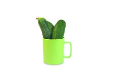 Three Cucumbers In Green Mug Royalty Free Stock Images