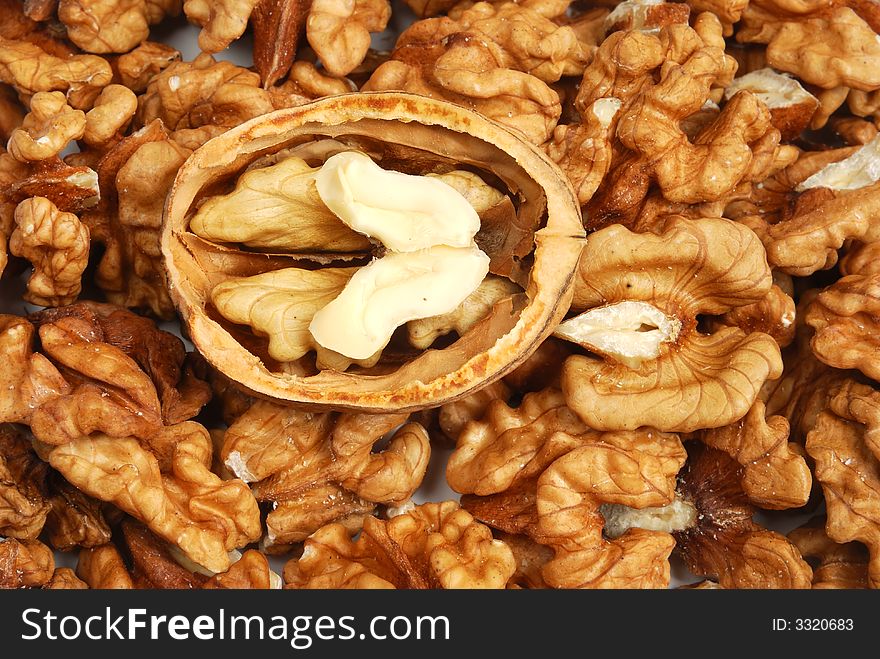 Many cracked walnuts - close up