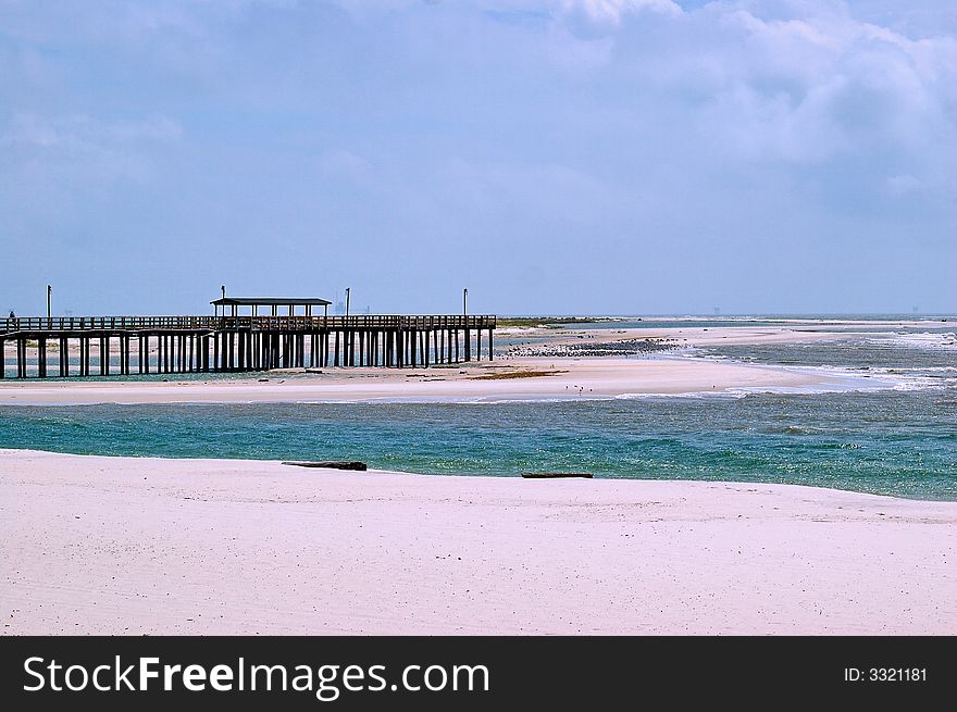 Pier on gulf of mexico with oil platforms in the background. Pier on gulf of mexico with oil platforms in the background