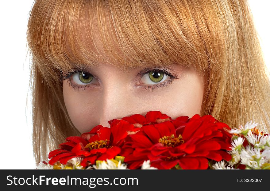 Beautiful girl's green eyes and bouquet of red flowers. isolated on white. Beautiful girl's green eyes and bouquet of red flowers. isolated on white.