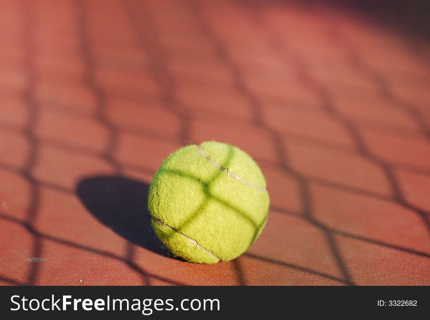 Tennis ball on the ground