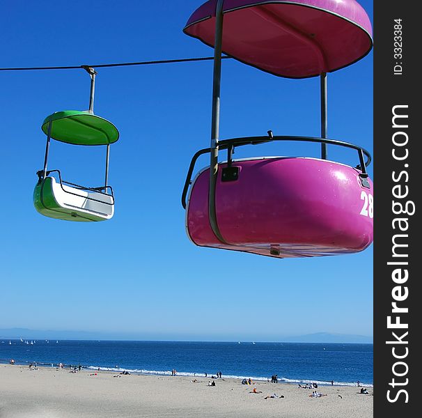 Colorful buckets flying over the beach boardwalk. Colorful buckets flying over the beach boardwalk