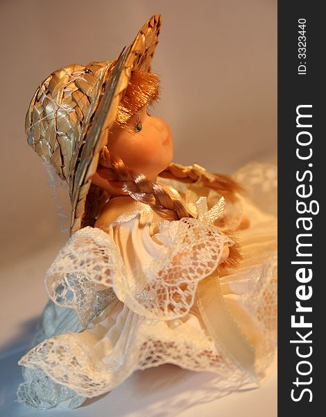 A doll of porcelain with hat and plait / Soft Lights / Portrait. A doll of porcelain with hat and plait / Soft Lights / Portrait