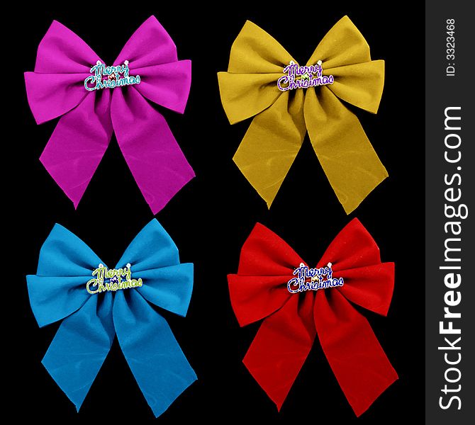 4 colorful christmas bows isolated over black