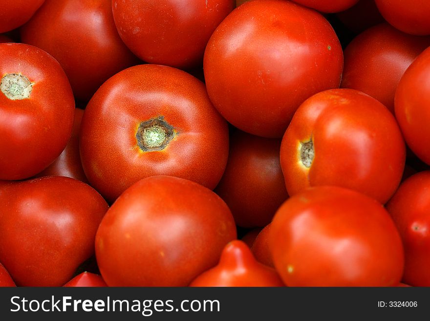 Group red and ripe a tomato close up. Group red and ripe a tomato close up