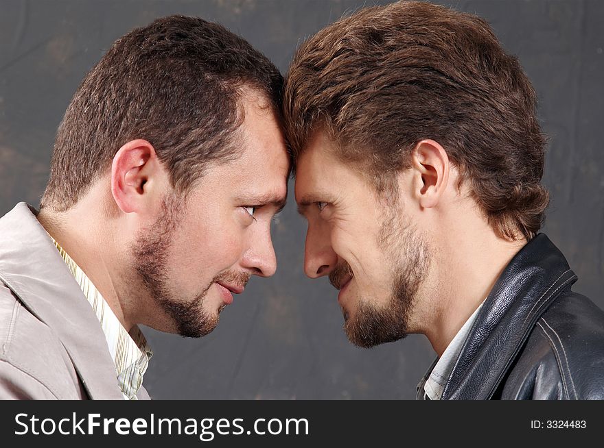 Two men looking onto each other. Two men looking onto each other