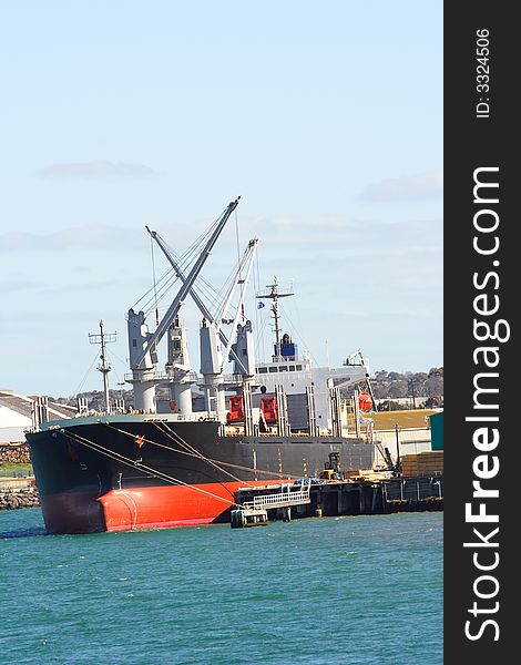 Cargo ship docked at wharf