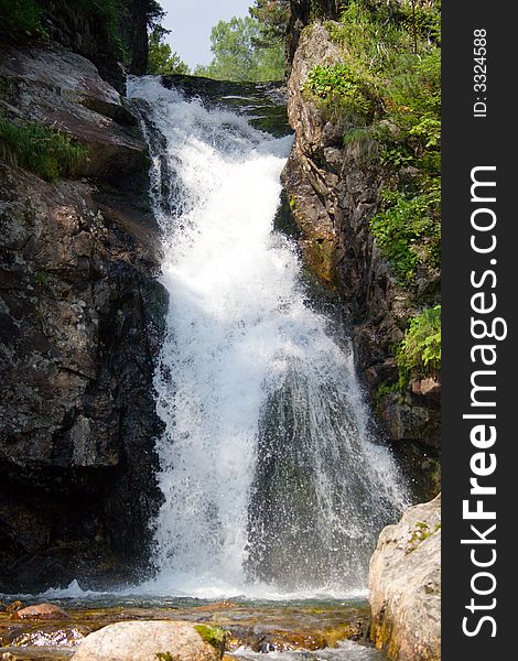 Waterfall grohotun (thunderer) on the same name brook (foothills of Sayan's mountain range)