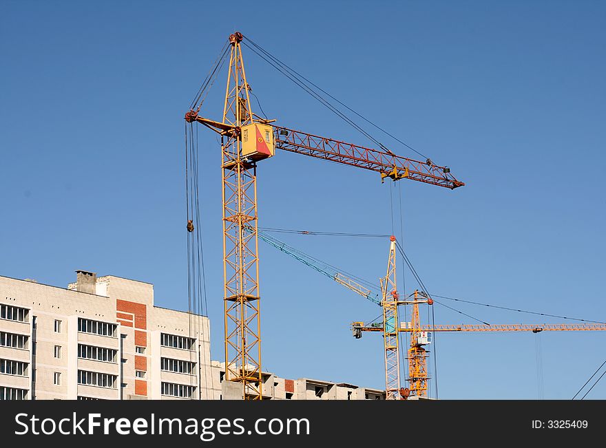 Construction of new apartment houses with application of tower cranes. Construction of new apartment houses with application of tower cranes