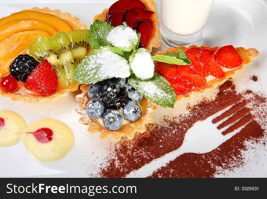 Mixed desert plate with panacotta and summer berries