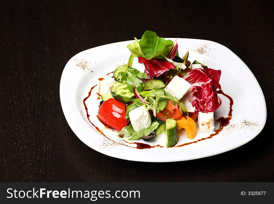 Greek or Italian Salad on the white plate