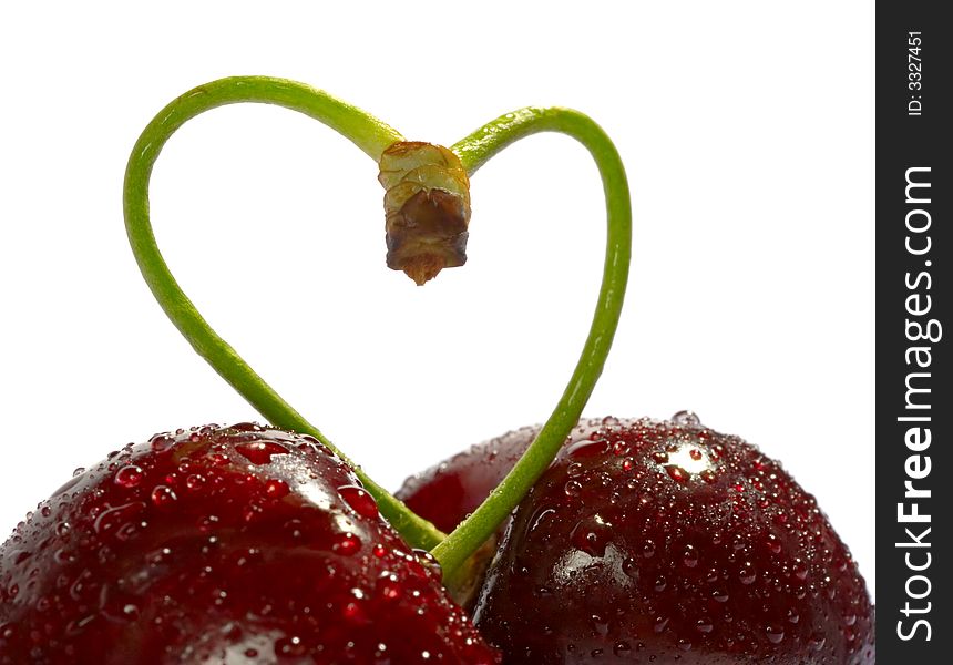 Cherries, heart shape isolated on white