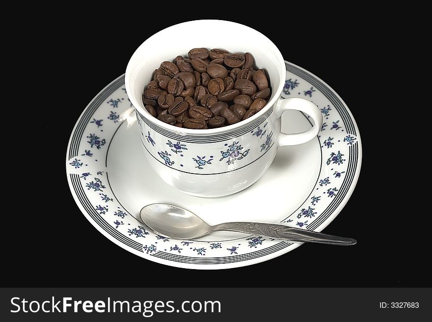 Coffee beans in cup of coffee