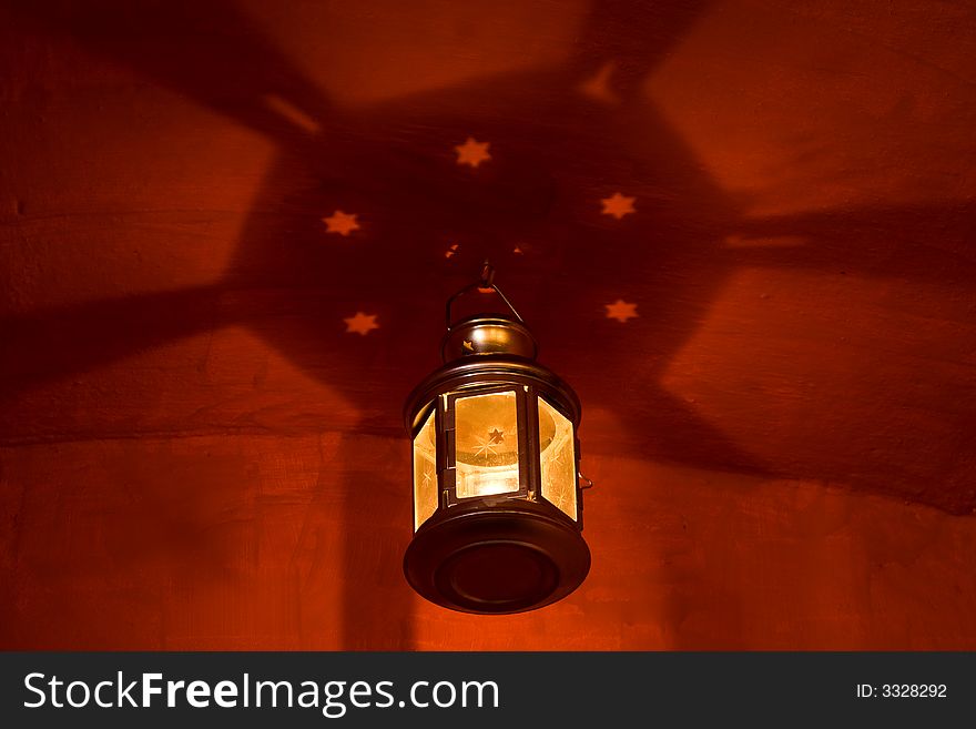 Beautiful hanging lantern against red wall