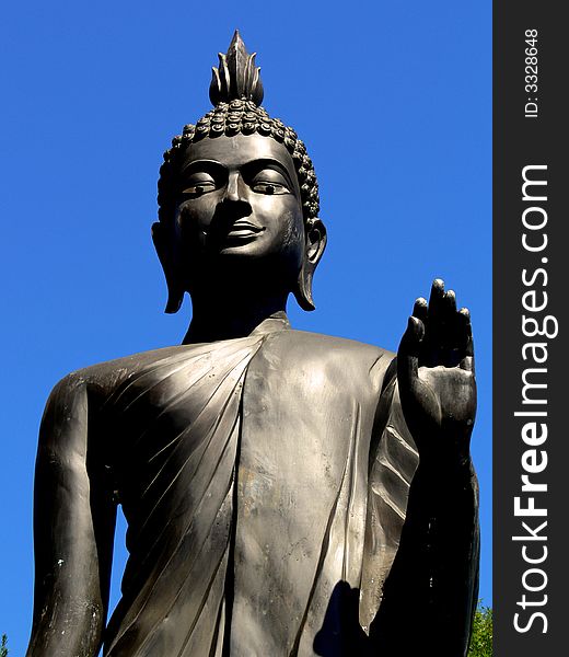 A shot of a large asian religious statue. A shot of a large asian religious statue.
